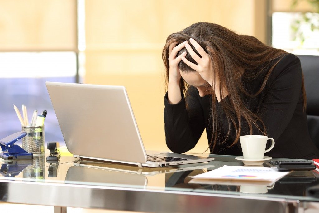 Woman emotionally stressed about the bankruptcy