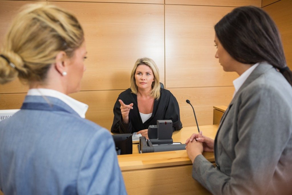 Female judge talking to lawyers