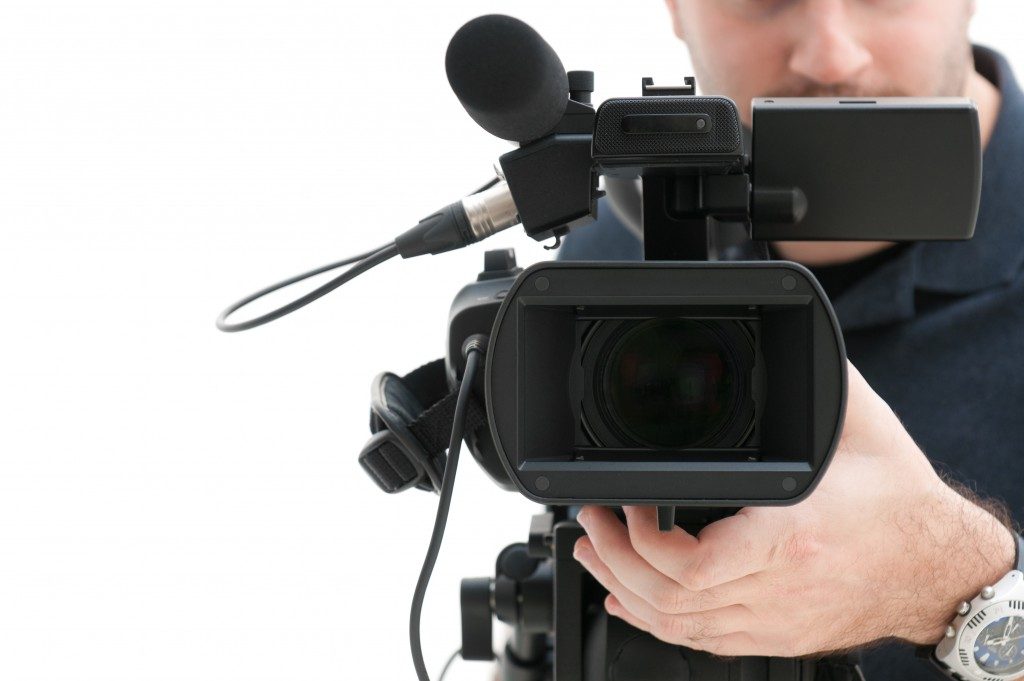 Court reporter using a video camera