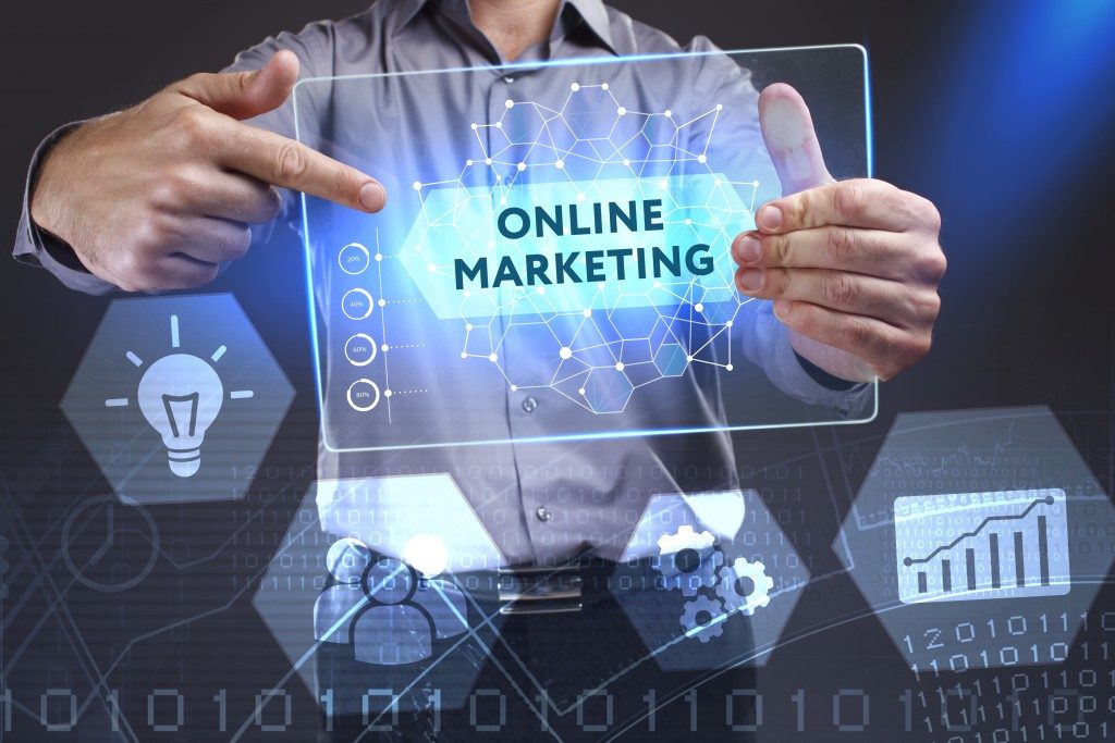 man holding online marketing virtual board