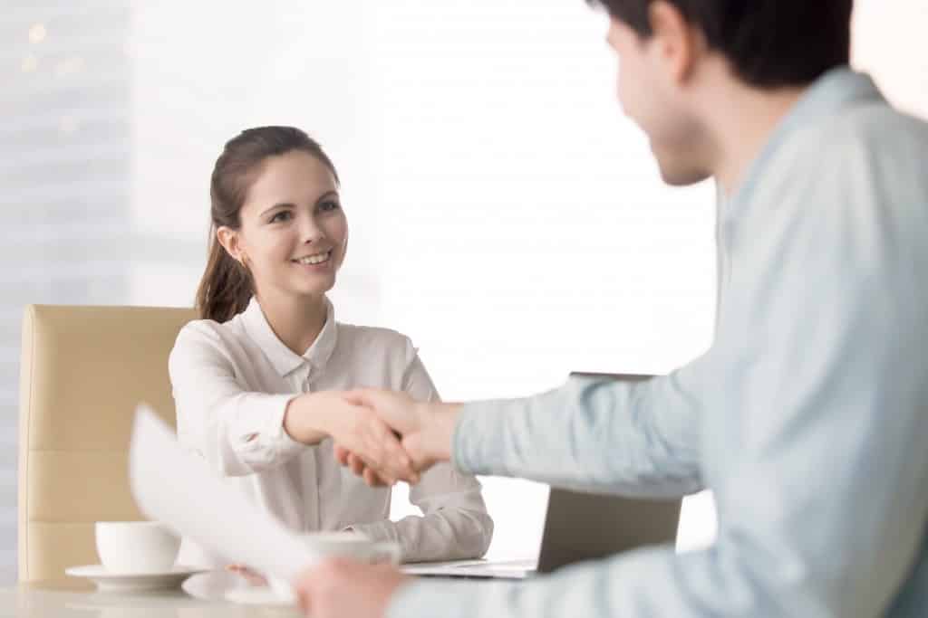 hr person shaking hands with an applicant