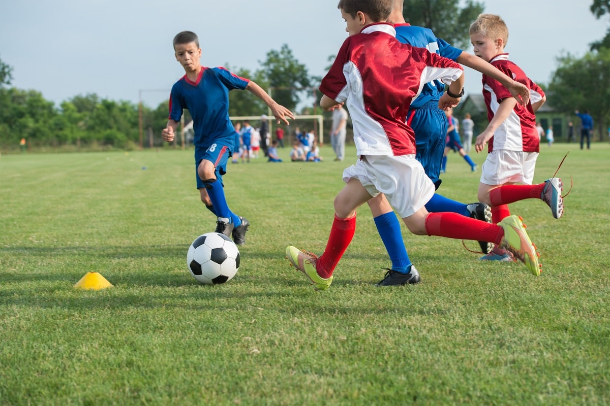 teens playing soccer