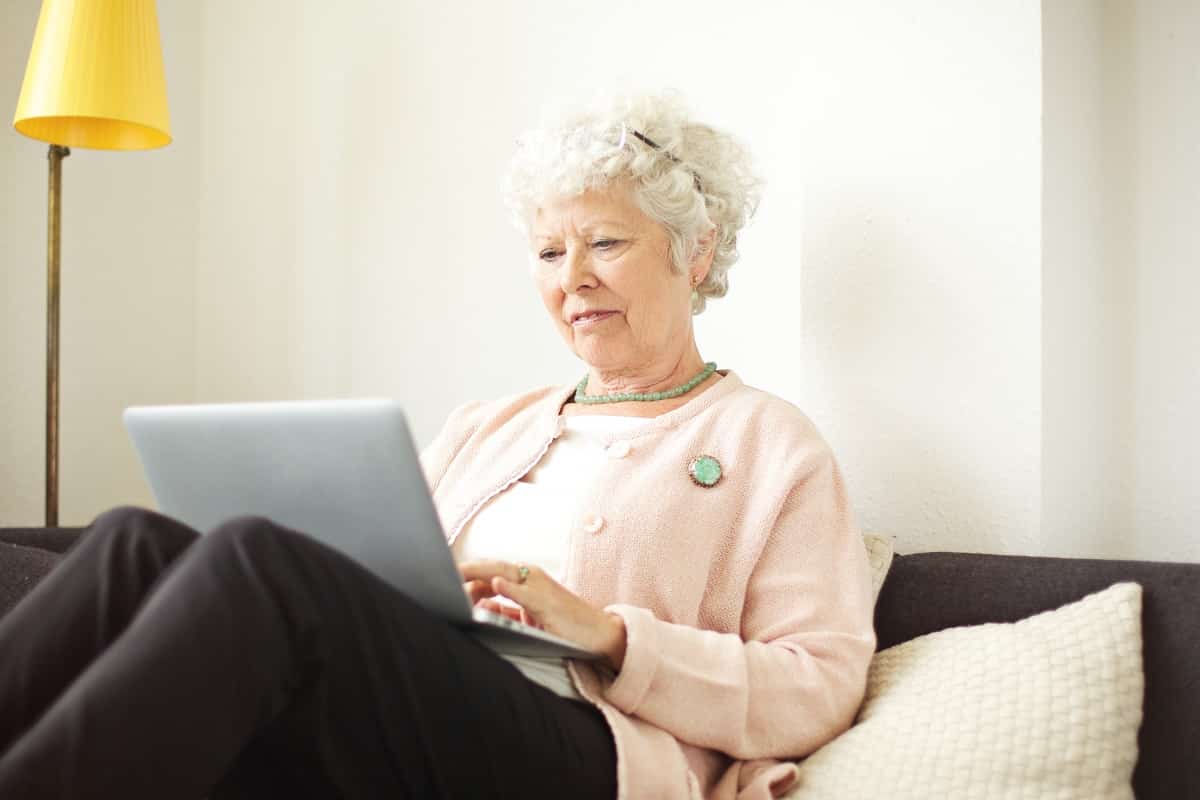 old woman using laptop