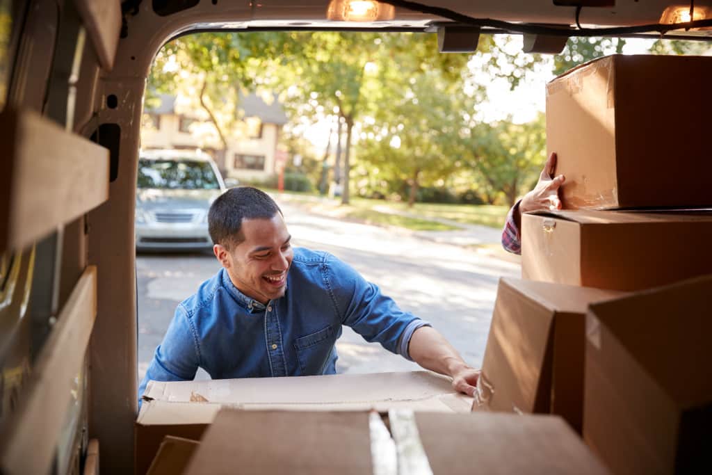 Guy unloading a box