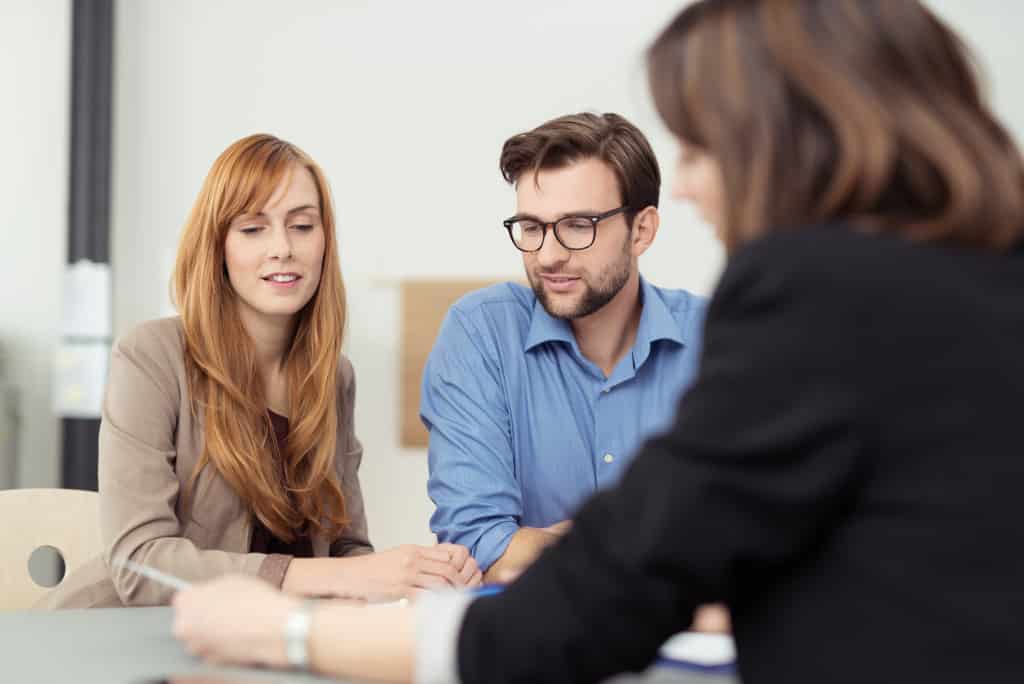 Insurance agent talking to couple