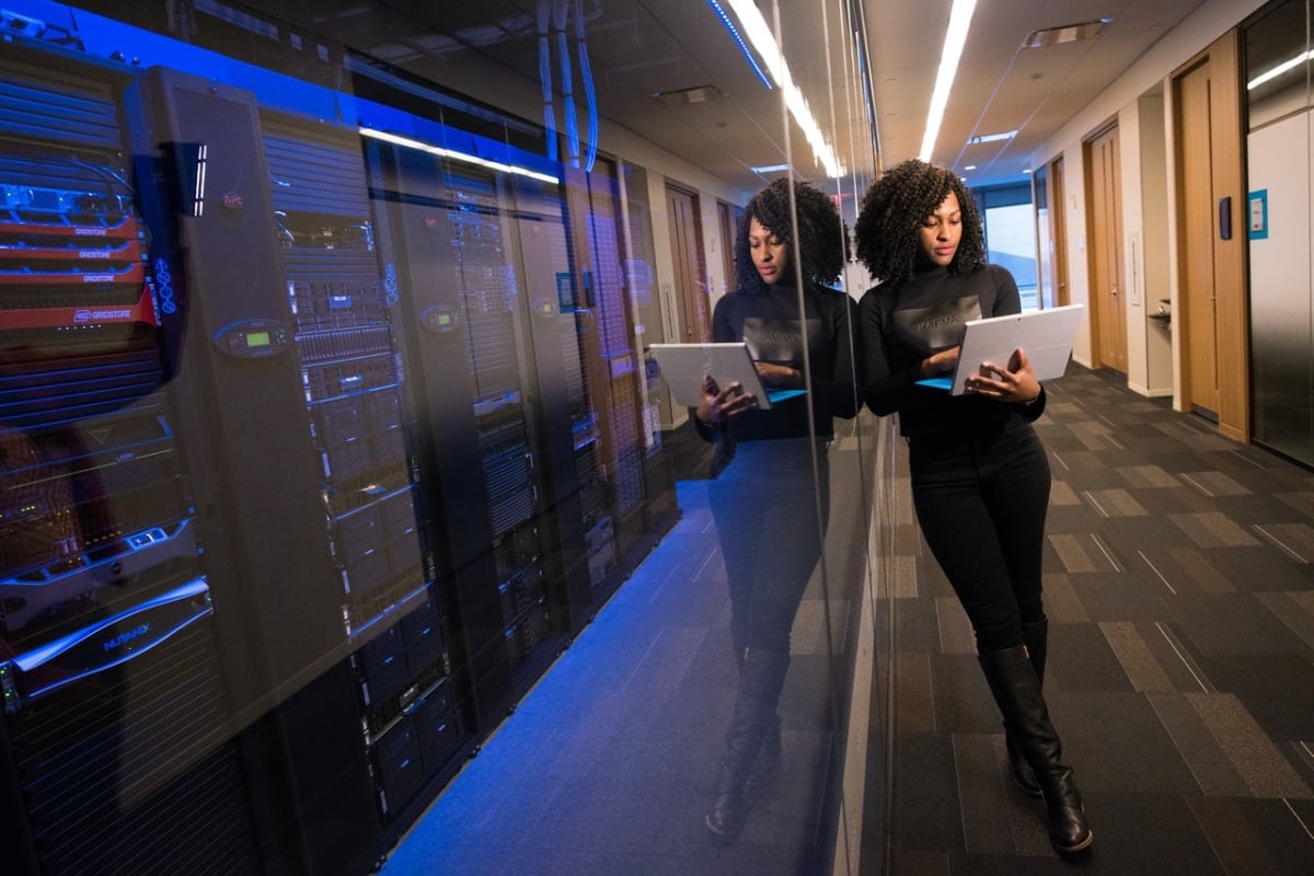 woman next to a database