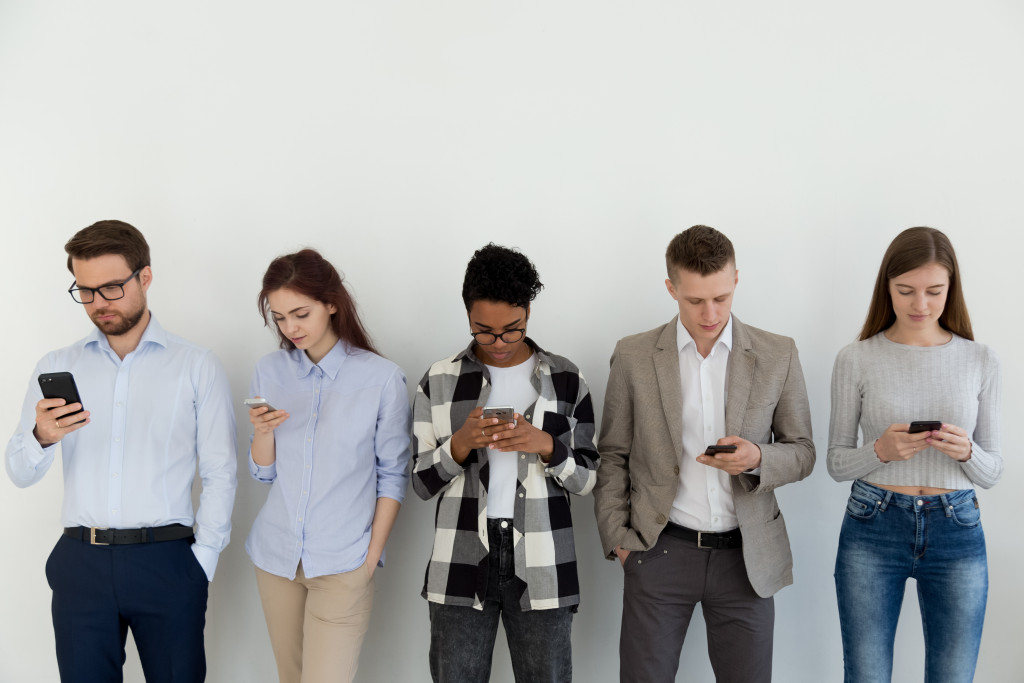 People looking at their devices 