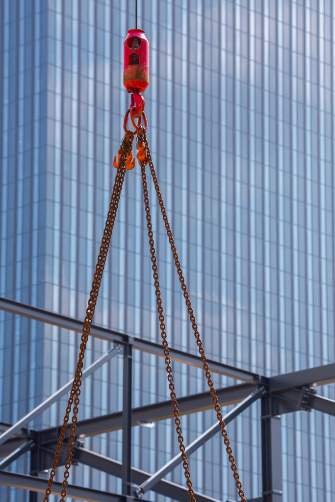 A crane's lifter hooked with a steel chain