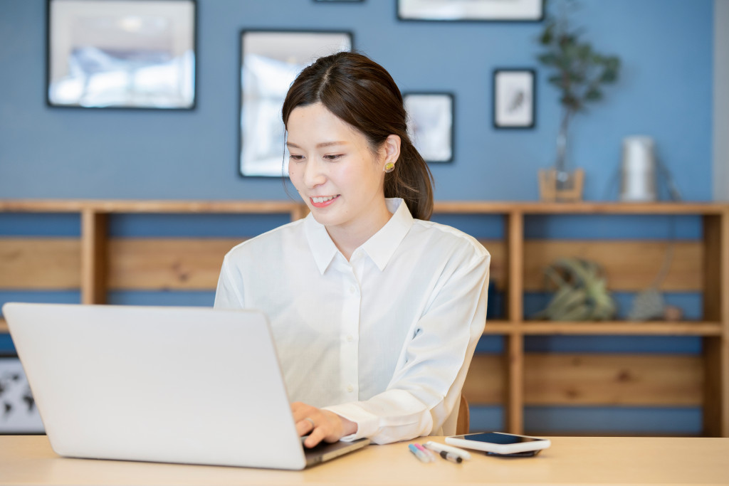 Woman working on laptop at home