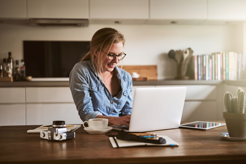 remote employee in the kitchen countertop working