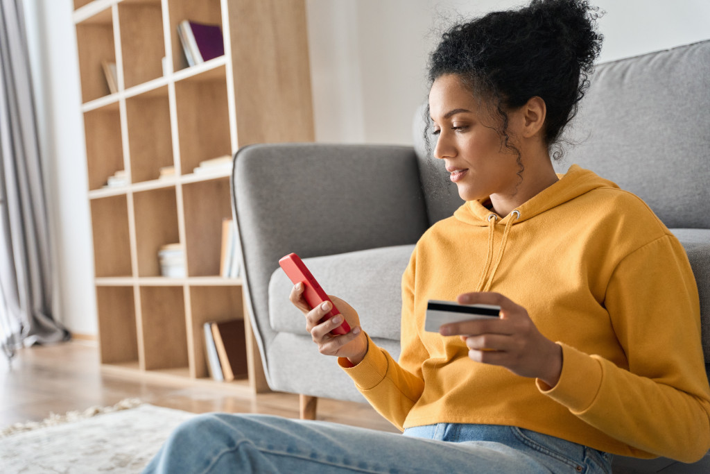 consumer online shopping using her mobile phone