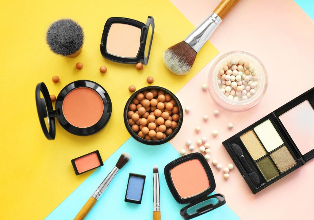 make up palettes, brushes, and powders