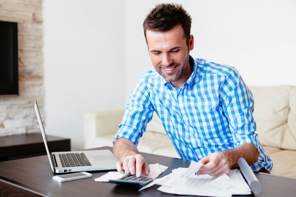 Young business executive analyzing employee expenses.