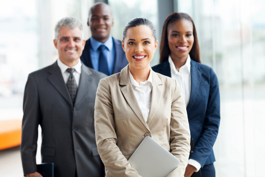 a group of business people smiling