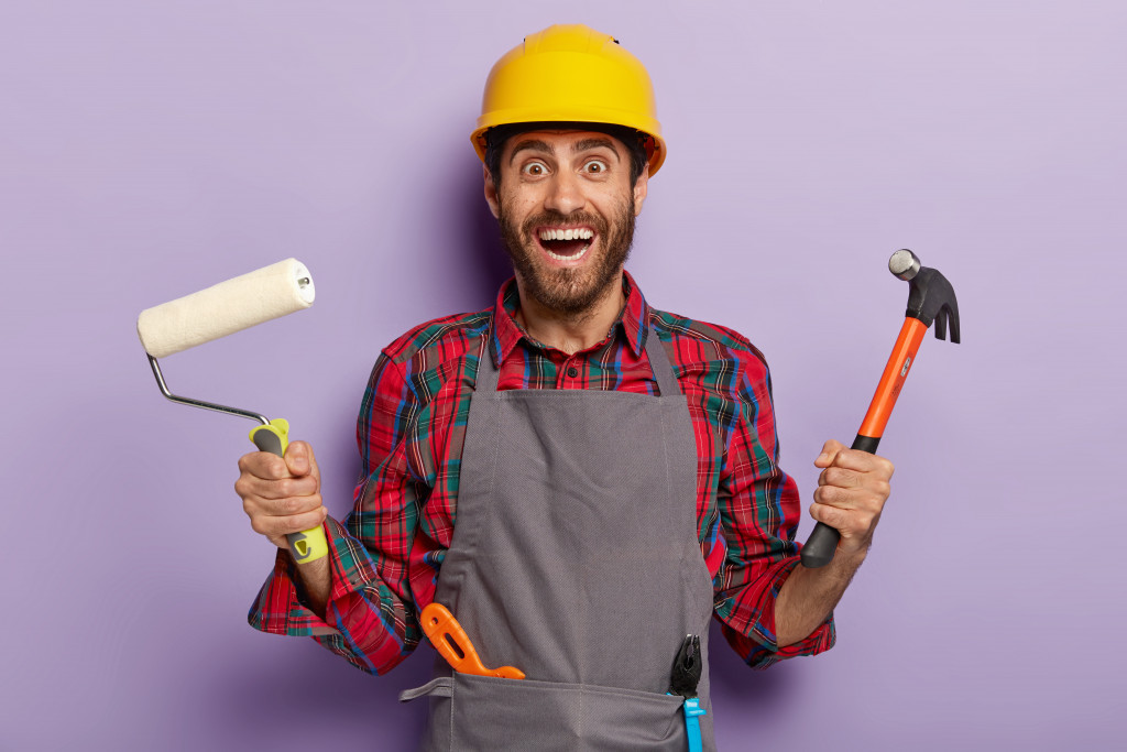 repairman holding tools for construction
