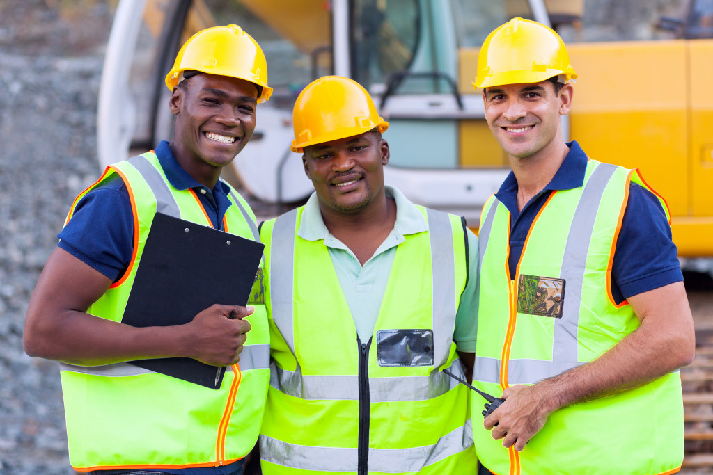 men wearing hard hat and safety vest